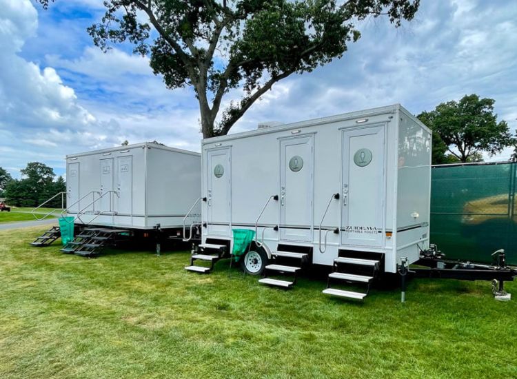 Exterior view of a portable restroom trailer set up on-site in NJ & NY